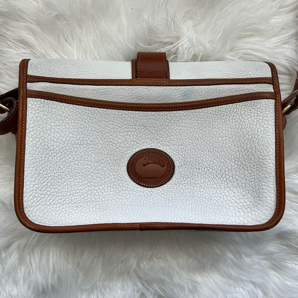 White Vintage Equestrian model Dooney and Burke Cross body purse.
